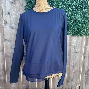 Beautiful Mesh Ruffled Lululemon Athletica Navy Top with mesh accent sleeves.